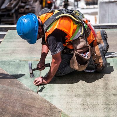 man-wearing-blue-hard-hat-using-hammer-544966_1